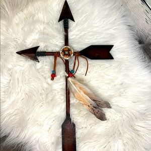 Rustic metal cross with feather